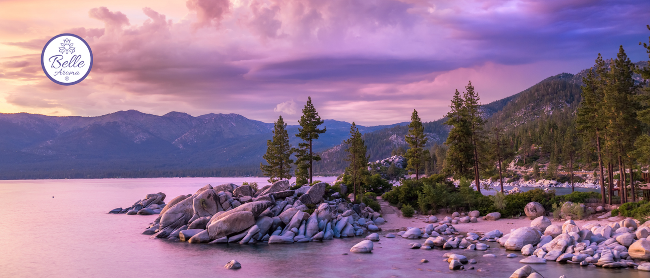 Scenic view of Lake Tahoe with clear blue water, surrounding Sierra Nevada mountains, and soft natural lighting, creating a calm, elevated travel atmosphere that reflects a peaceful outdoor destination.